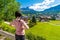 Girl watching over tourist huts in Cortina d`Ampezzo, Dolomites mountains, Italia