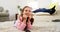 Girl watching tv lying on the rug in the living room