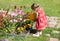 Girl watering flower beds