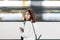 A girl is wating a train in a trian station at Geneva, Switzerland.