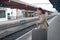 A girl is wating a train in a trian station at Geneva, Switzerland.