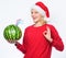 Girl wear santa hat drink watermelon vitamin cocktail straw. Woman enjoy vitamin drink. Rich vitamin ration concept. How