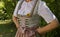 girl wearing a beautiful luxury traditional Bavarian dirndl dress (Tracht) (Munich, Bavaria, Germany)