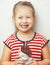 Girl wearing dress with stripes and holding chocolate