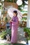 The girl is wearing a pink traditional yukata, which is the national dress of Japan