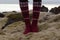 Girl wearing red Icelandic wool socks standing in.