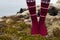 Girl wearing red Icelandic wool socks standing in.