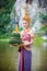 Girl wearing red Thai traditional dress Loy Krathong