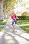 Girl Wearing Rucksack Cycling To School