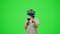 The girl wearing VR headset gaming in virtual reality boxing game.The woman fighting on chroma key green screen