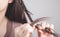 Girl weaving her hair on a braid