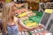 Girl weighing goods in shop