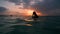 girl with wet hair and lips in the sunset in the water underwater