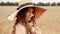 Girl wheat field summer. Happy young woman in sun hat in summer wheat field at sunset. Nature, summer holidays, vacation