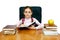 Girl which reads a book at the writing table