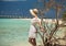 Girl in white dress on the beach. Maldives. Tropics. Vacation.