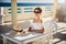 Girl in white dress on vacation. Sits by the table. Rest, travel, vacation. Tunisia.