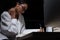 Girl in white shirt reading many textbooks on table with many hi