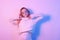 Girl in a white sweater in neon light. Masked woman, fashion photo