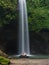 Girl in a white swimming costume at SEKUMPUL WATERFALL,near ubud,Bali