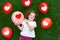 Girl in a white T-shirt holding a colored balloon