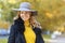 Girl white toothed smile, young happy woman whitened teeth in grey hat in autumn in the park