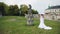 The girl in a white wedding dress near the castle