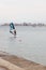 Girl windsurfing near the coast of Rosas