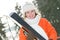 Girl at winter clothing with skis