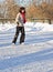 Girl on winter skate rink