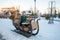 The girl on the winter sled, large sled for skiing. Girl riding a reindeer sleigh