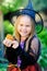 Girl in witch costume eat cupcake on Halloween