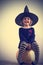 GIRL in witch\'s hat pumpkin
