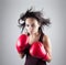 girl woman athlet in red boxing gloves kicking