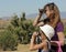 A Girl and a Woman Look Through Binoculars