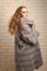 Girl or woman wear grey mink fur coat