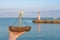 Girl with wooden boat in the hand