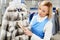 Girl worker performs dry Laundry, hand cleaning fur garments