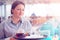 Girl working as waitress holding a tray with tea