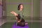 Girl working yoga stretches in a studio