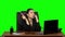 Girl at workplace is working on laptop, talking on phone and sawing nails. Green screen. Slow motion
