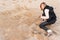 Girl Writing New Year in Sand