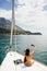 Girl yachting with smartphone photograph cruise