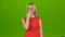 Girl yawns covering her mouth with hand. Green screen studio