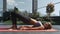 Girl in Yoga Pose Lifts Pelvis Lying on Pink Mat