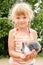 Girl with young bunny rabbit