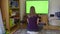 Girl young woman blonde watching chroma key green tv screen sitting