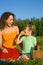 Girl and Young Women eats fruits on picnic