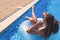 Girl with zizi cornrows dreadlocks lying in swimming circle