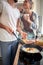 Girlfriend enjoying watching her boyfriend preparing a breakfast. Cooking, together, kitchen, relationship